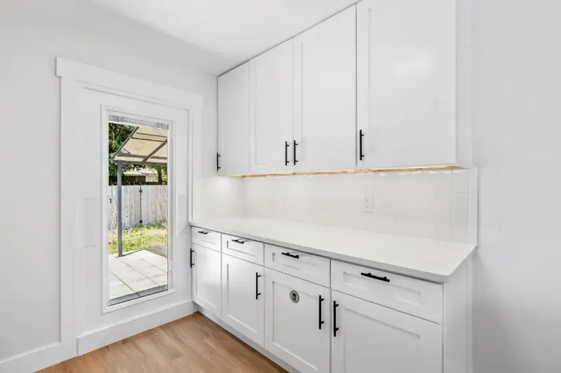 New cabinets, countertop and tall glass window with built-in blinds installed in Jacksonville, FL