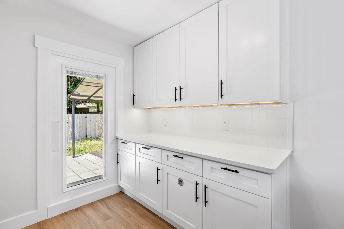 New cabinets, countertop and tall glass window with built-in blinds installed in Jacksonville, FL