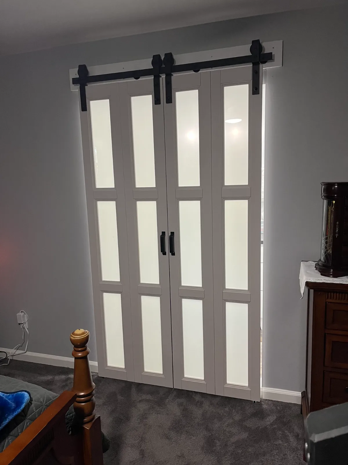 Modern bifold barn door installed in bathroom in Jacksonville, FL
