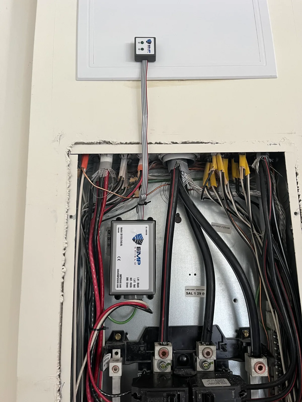 Whole-house EMP Shield surge protector installed on electrical panel in St. Johns, FL