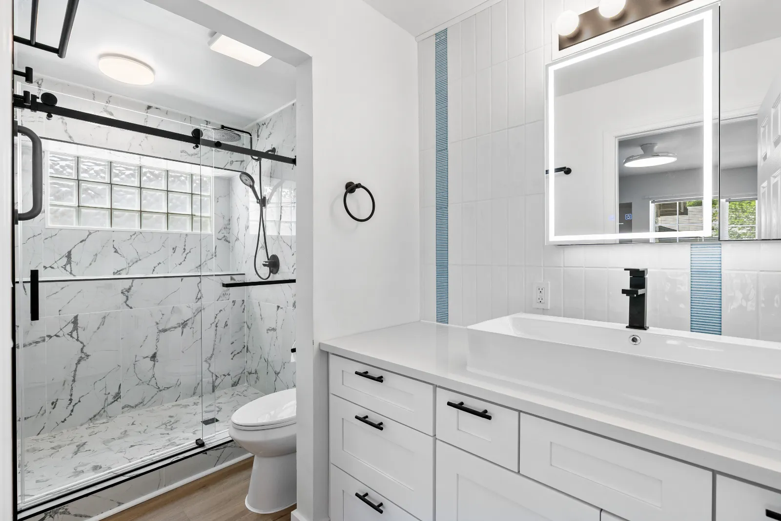 Fully remodeled bathroom with marble shower and vanity